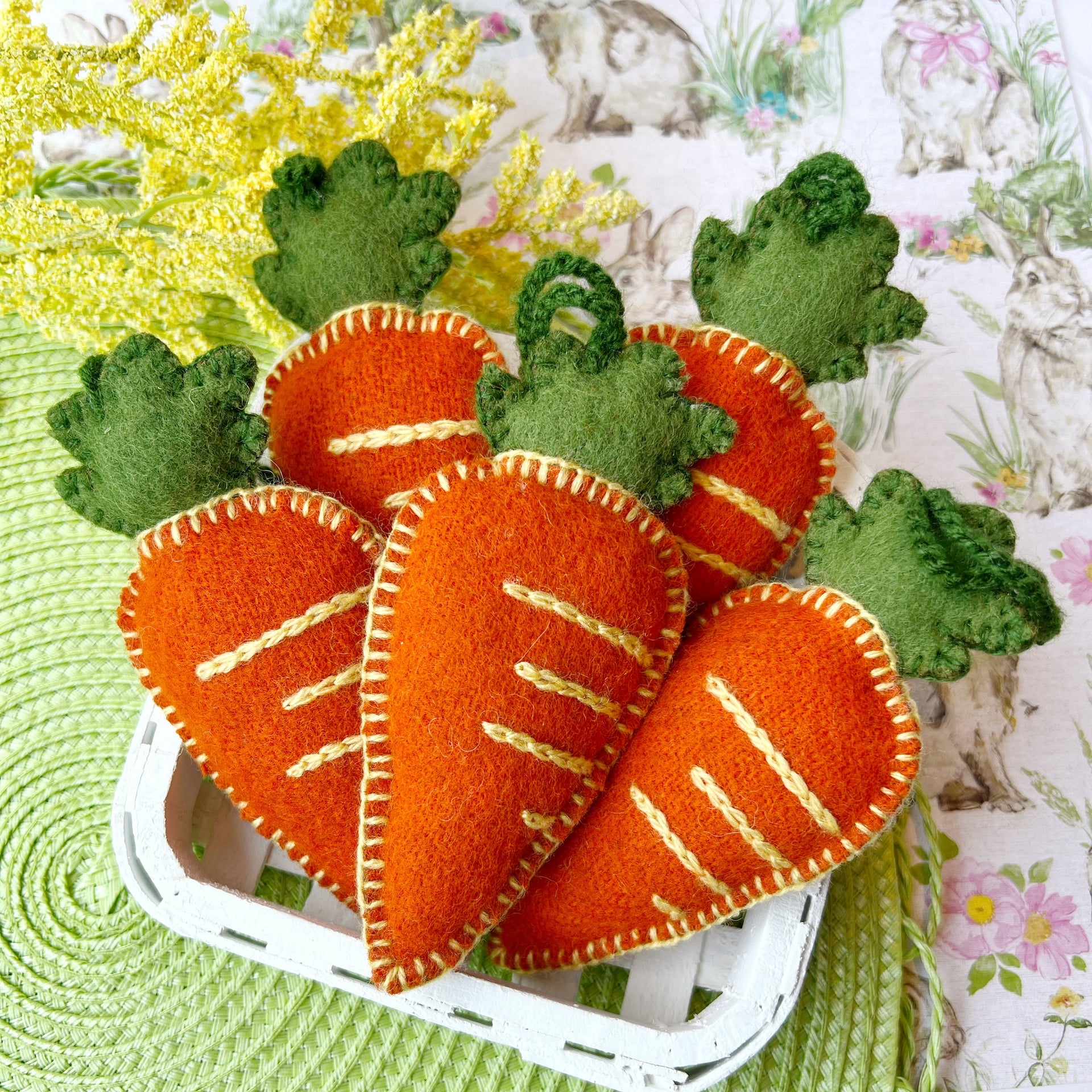 A basket of handmade Carrot Easter ornaments.