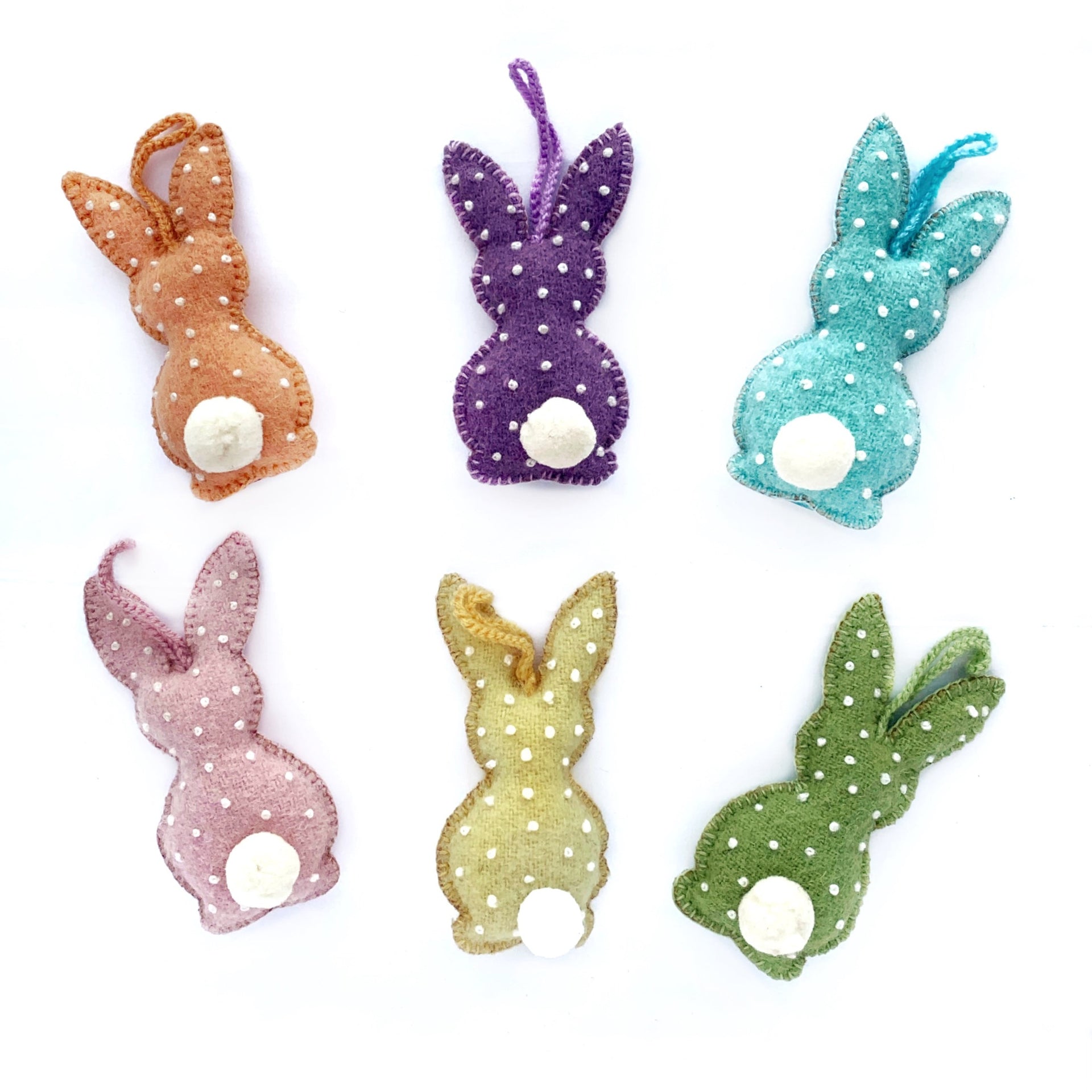Set of six handmade embroidered Easter Bunny Ornaments in pastel colors.