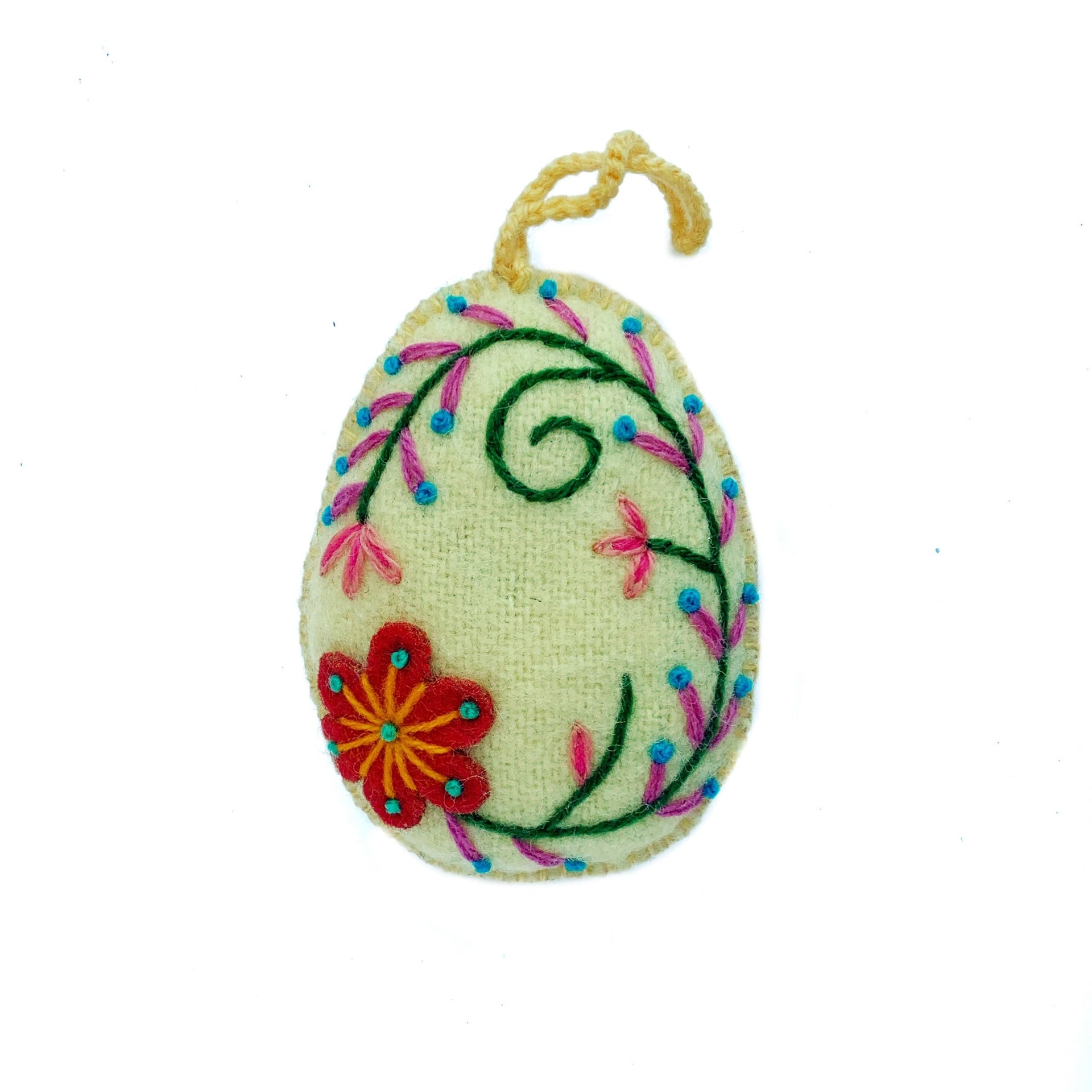 Soft yellow pastel Easter egg ornament with hand embroidered flowers and designs.