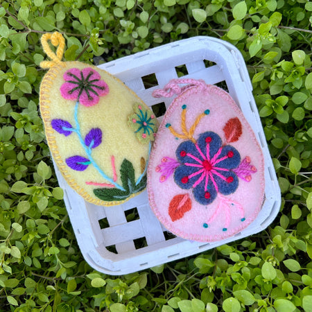 Two handmade Embroidered Easter Egg Ornaments in Basket