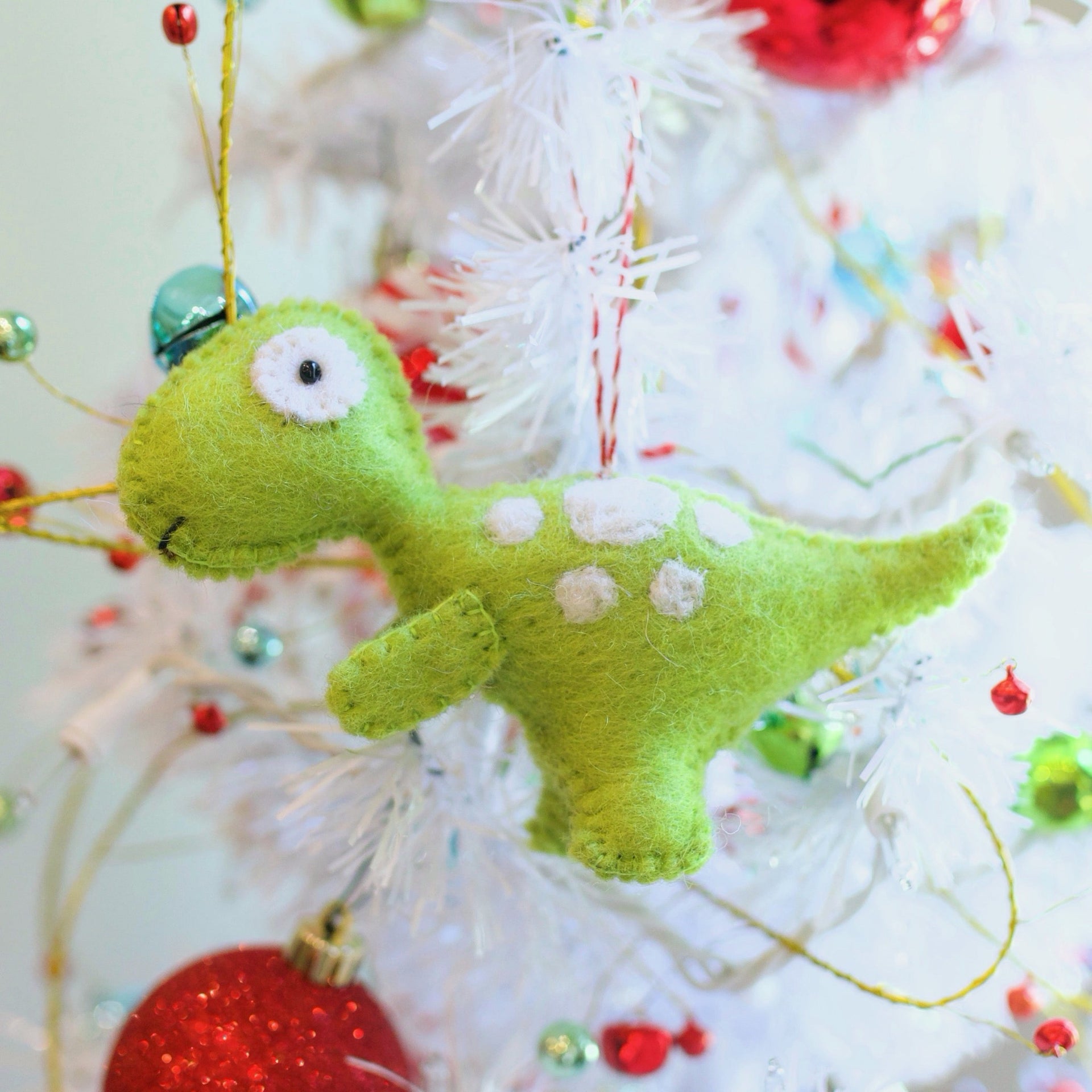 T-rex Dinosaur Christmas Ornament on holiday tree