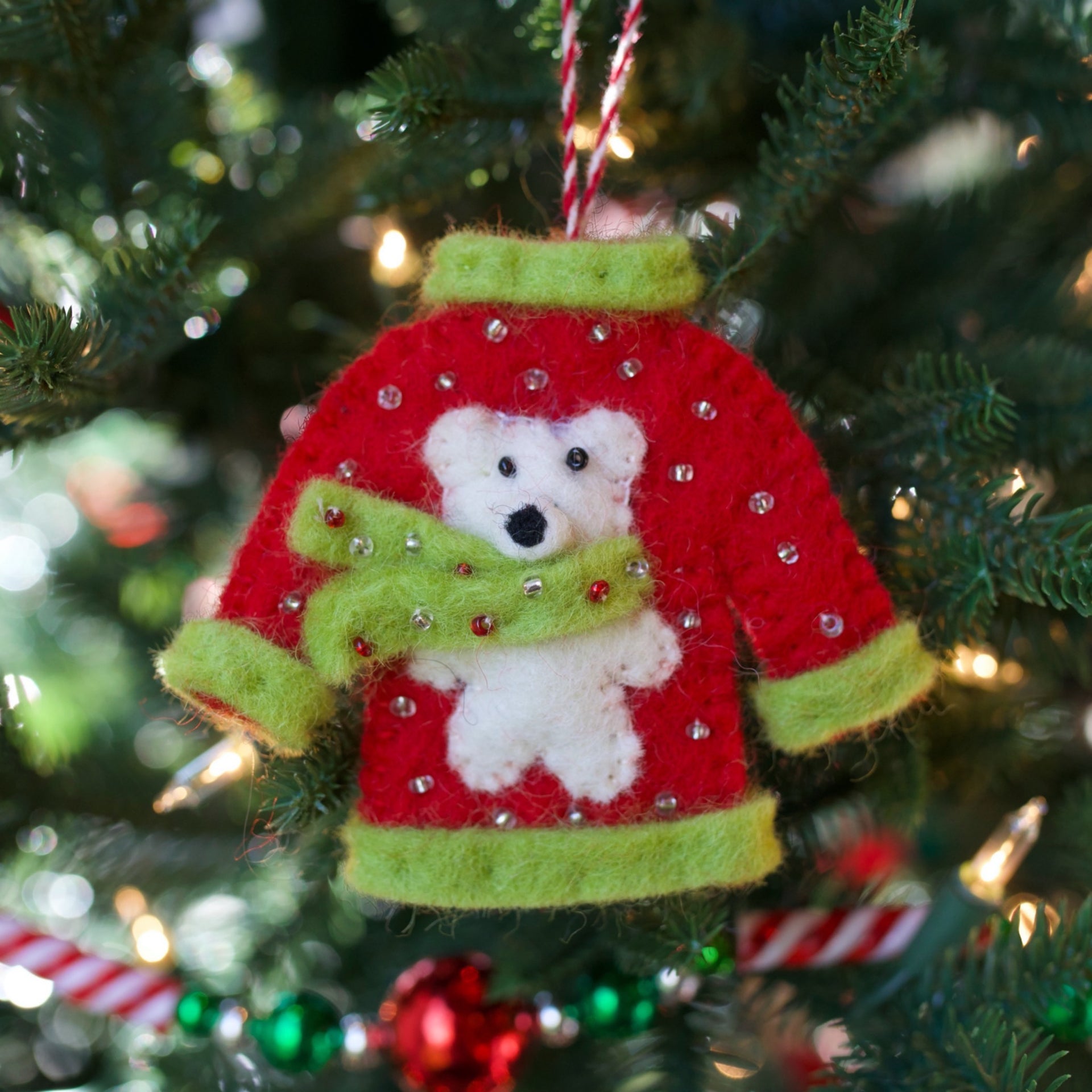 Ugly Christmas Sweater with Polar bear hanging on Christmas tree