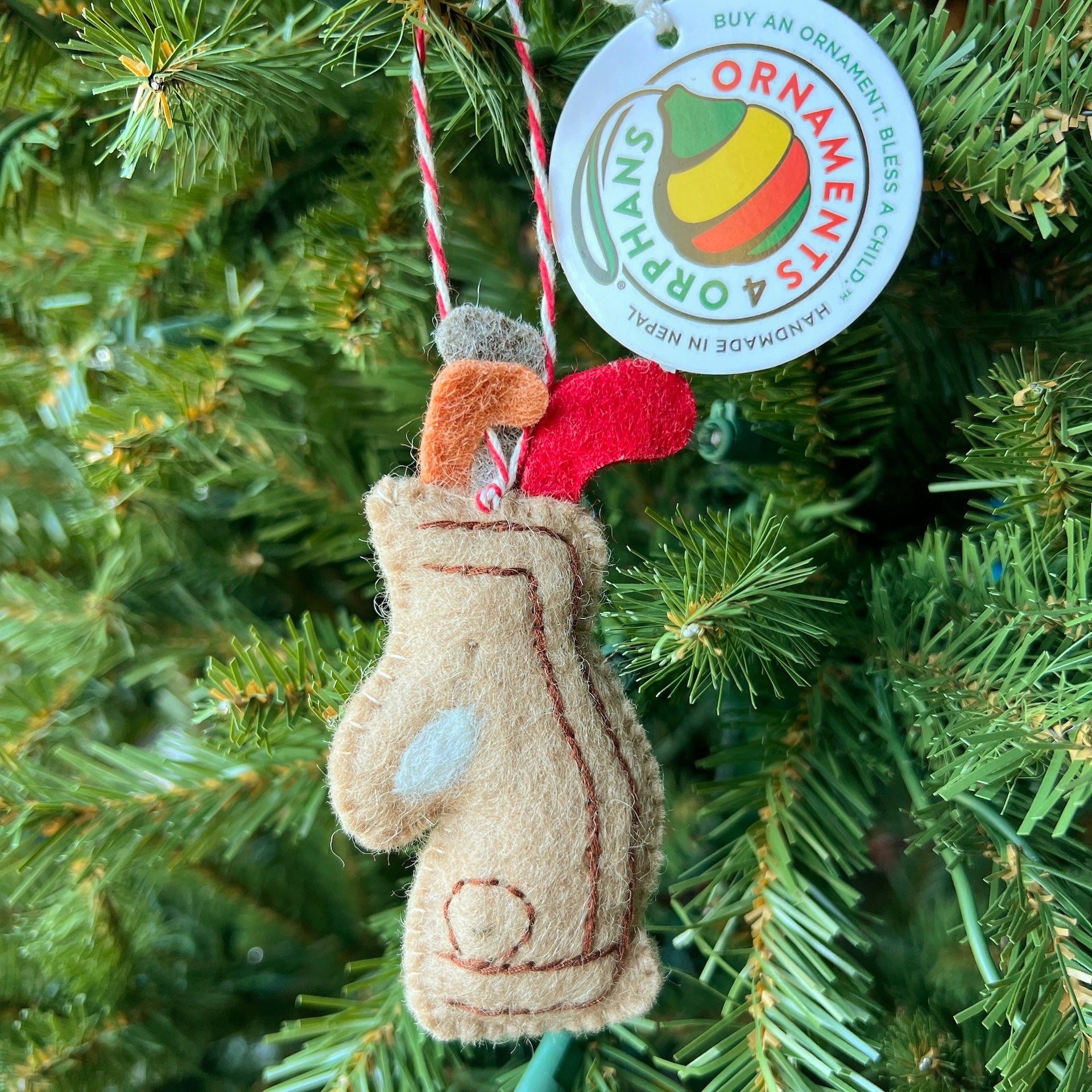 Golfer Christmas Ornament Gift hanging on holiday tree