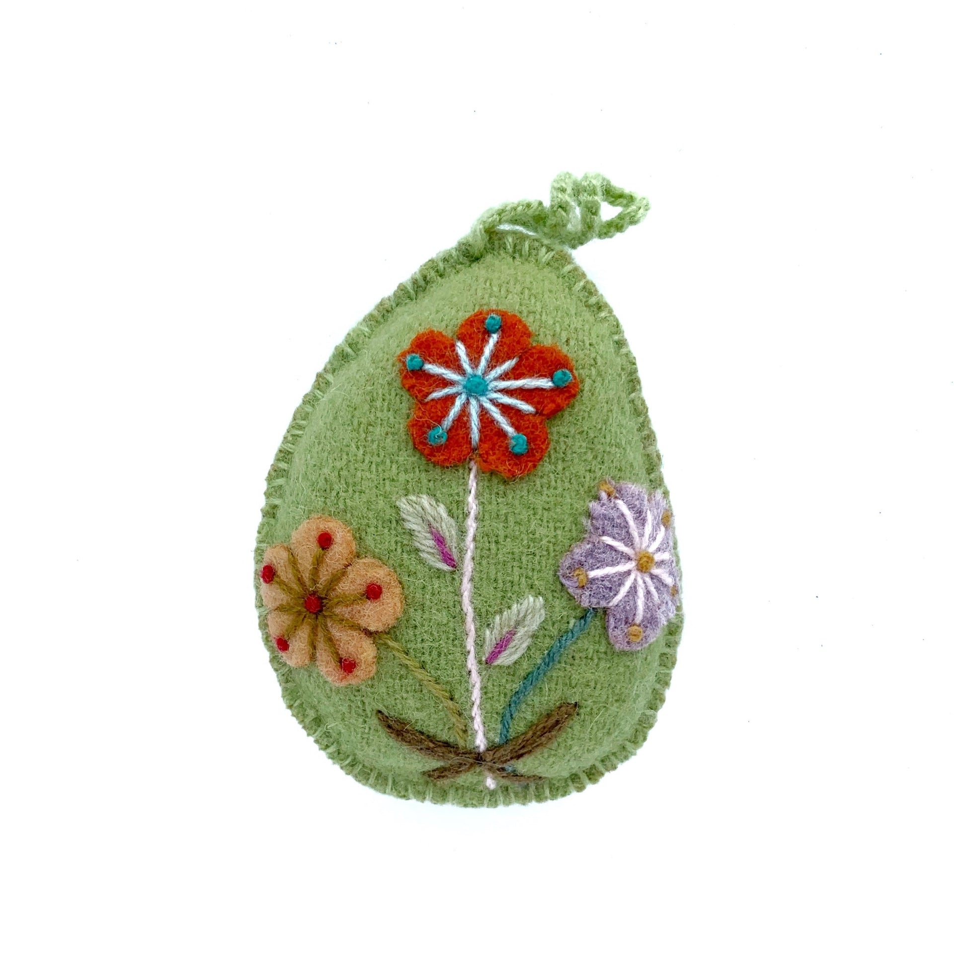 Soft green pastel Easter egg ornament with hand embroidered flowers and designs.
