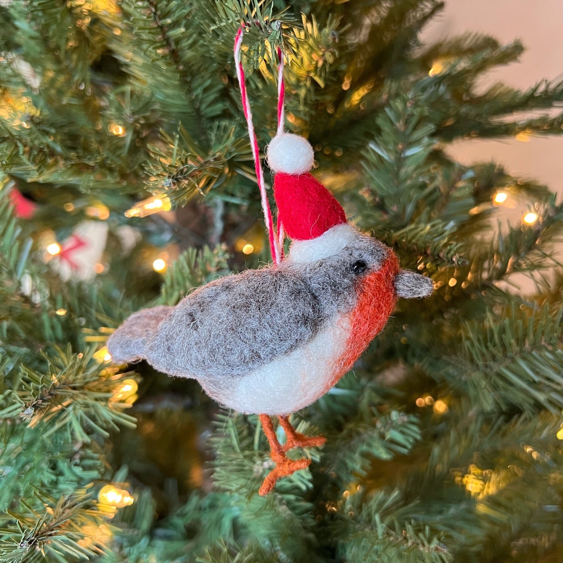 festive felt christmas bird in hat ornament hanging on tree