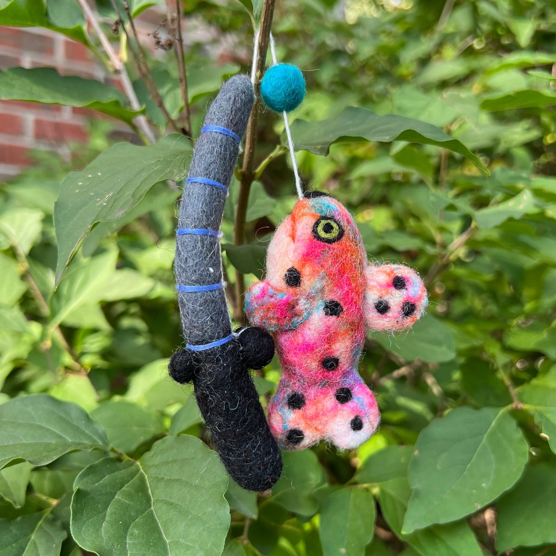 rainbow trout caught on a fishing pole ornament