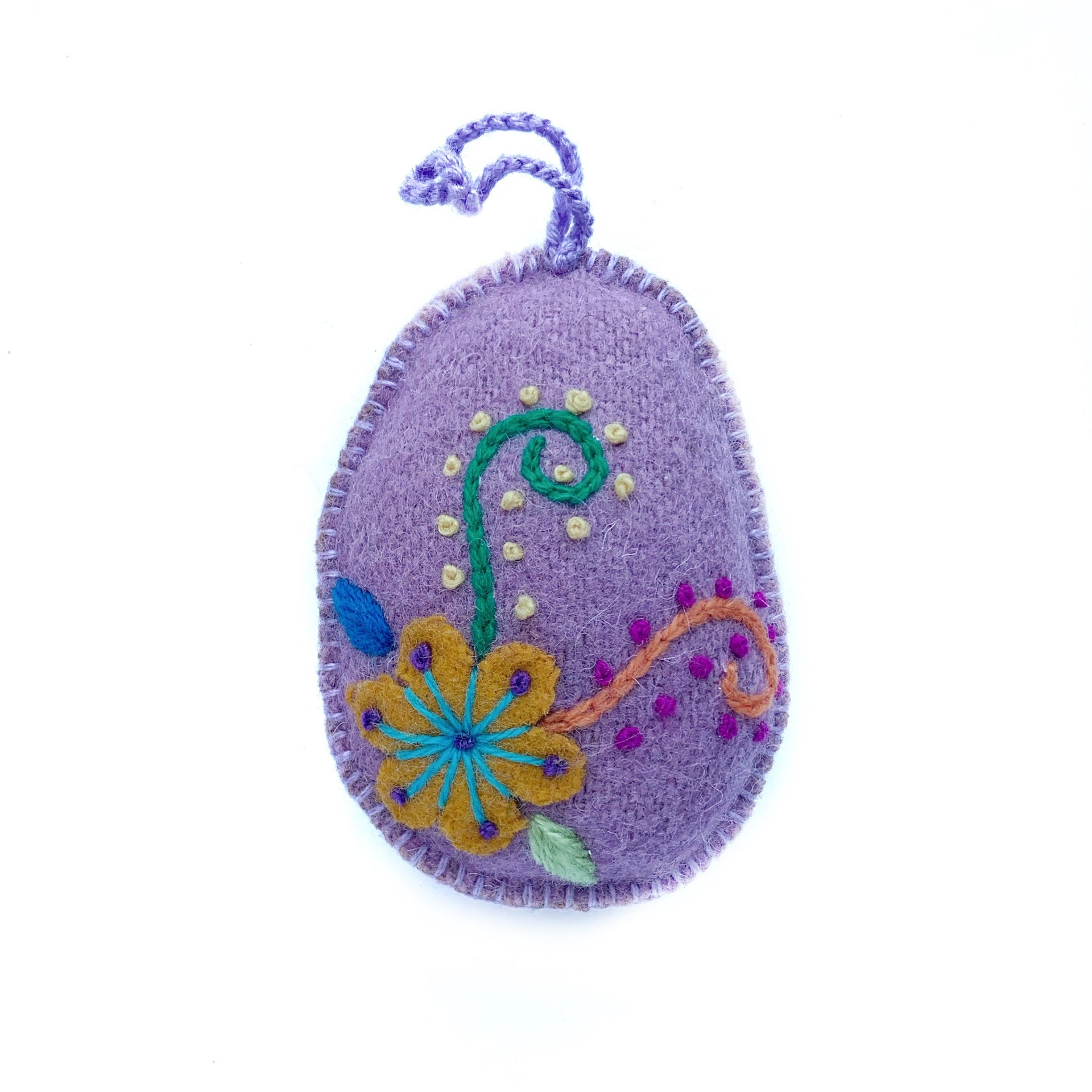 Soft purple pastel Easter egg ornament with hand embroidered flowers and designs.