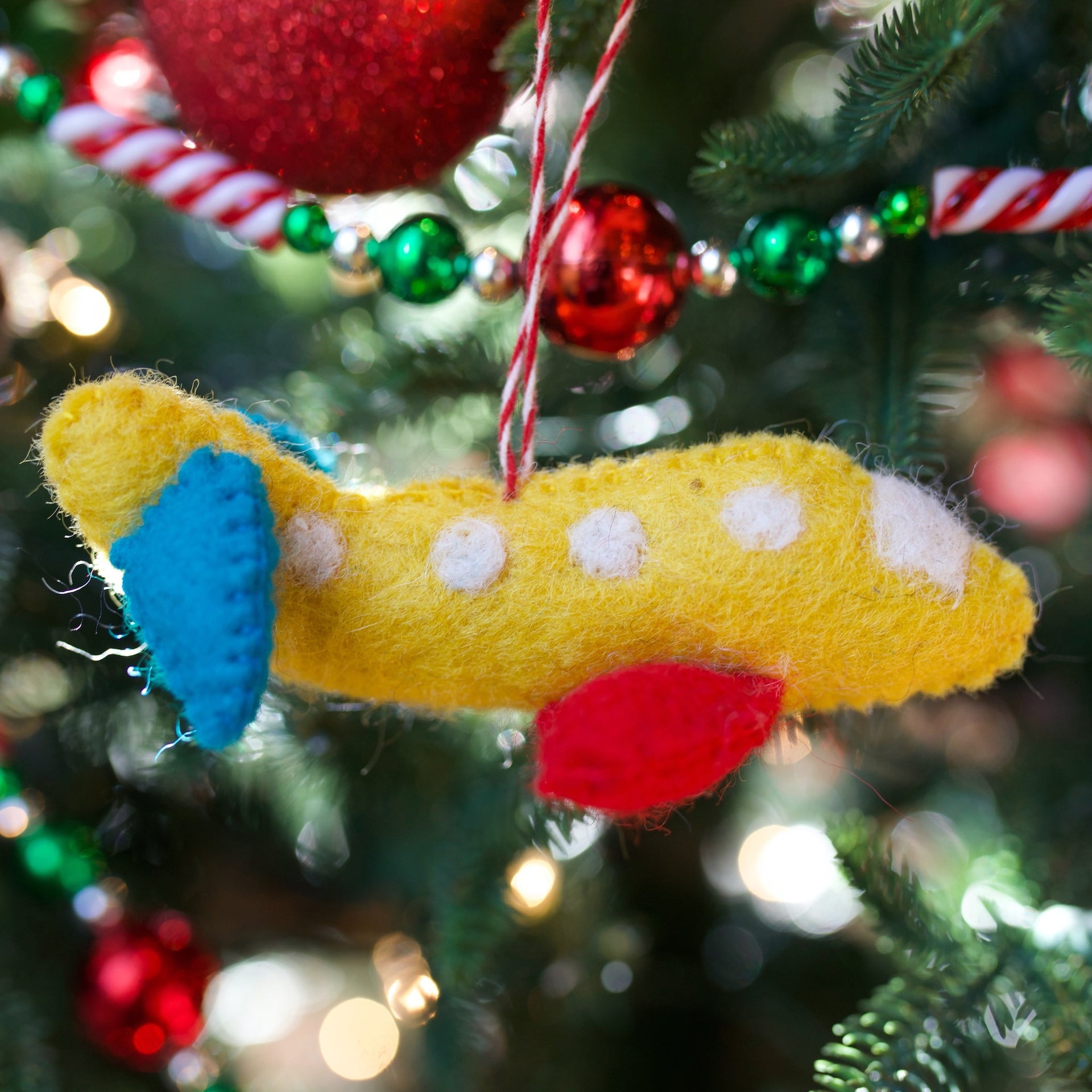 Kid Airplane Ornament on Christmas Tree Fair Trade Handmade