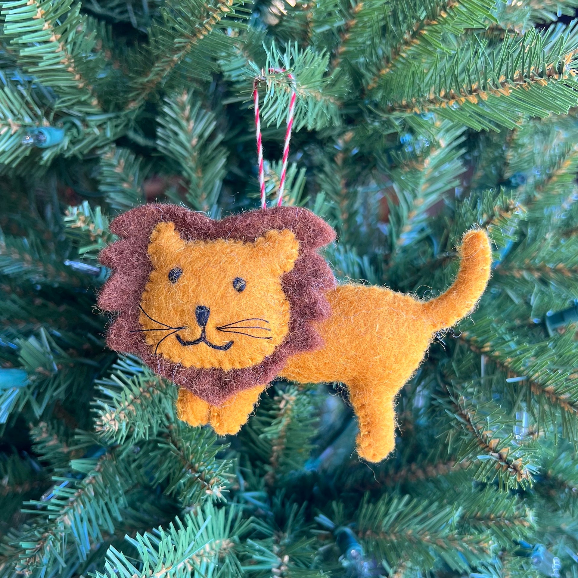 Cute lion Ornaments 4 Orphans Christmas ornament hanging on a tree