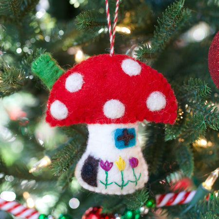 cute mushroom ornament hanging on a Christmas tree
