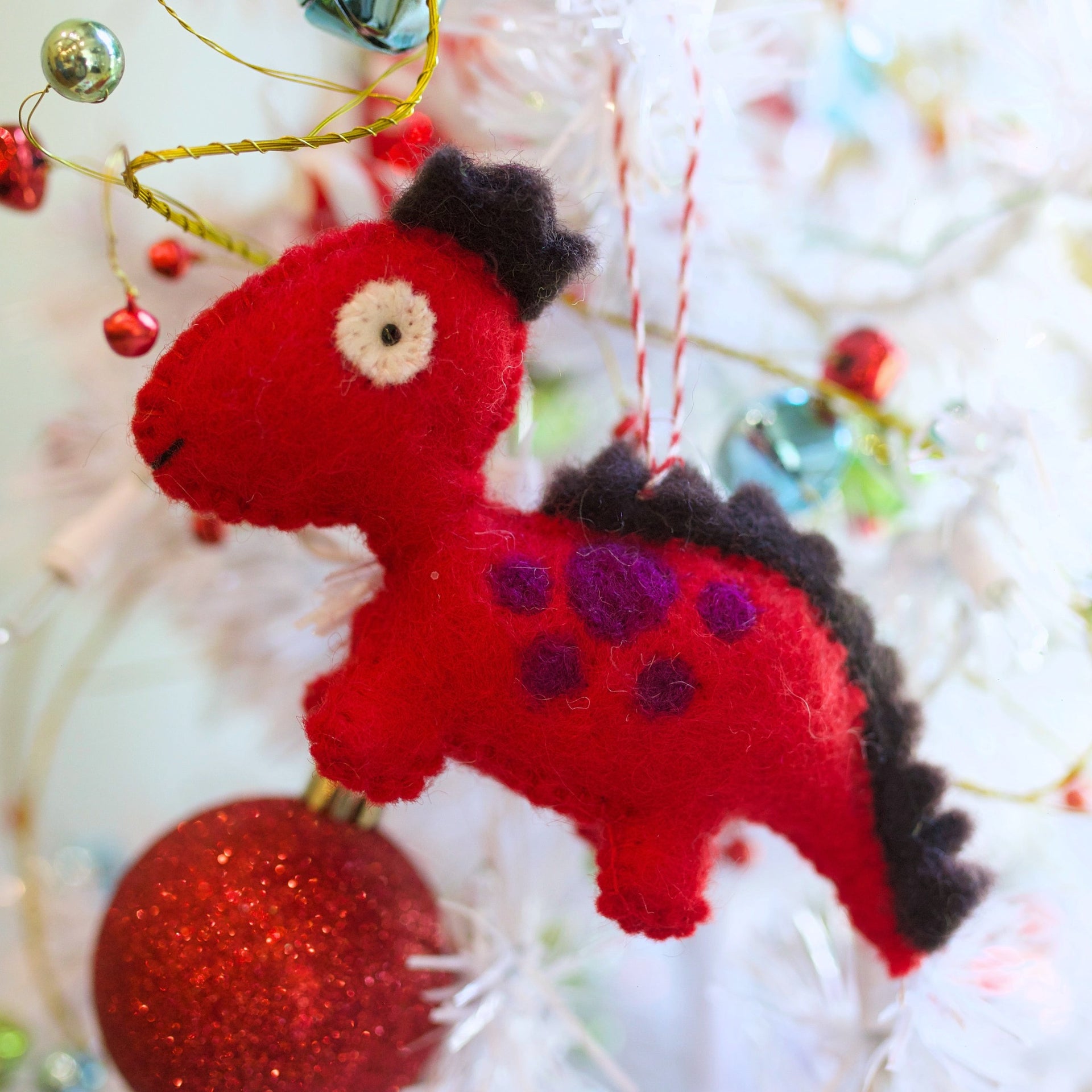 Red Dinosaur Ornament Hanging on Christmas Tree Ornaments 4 Orphans