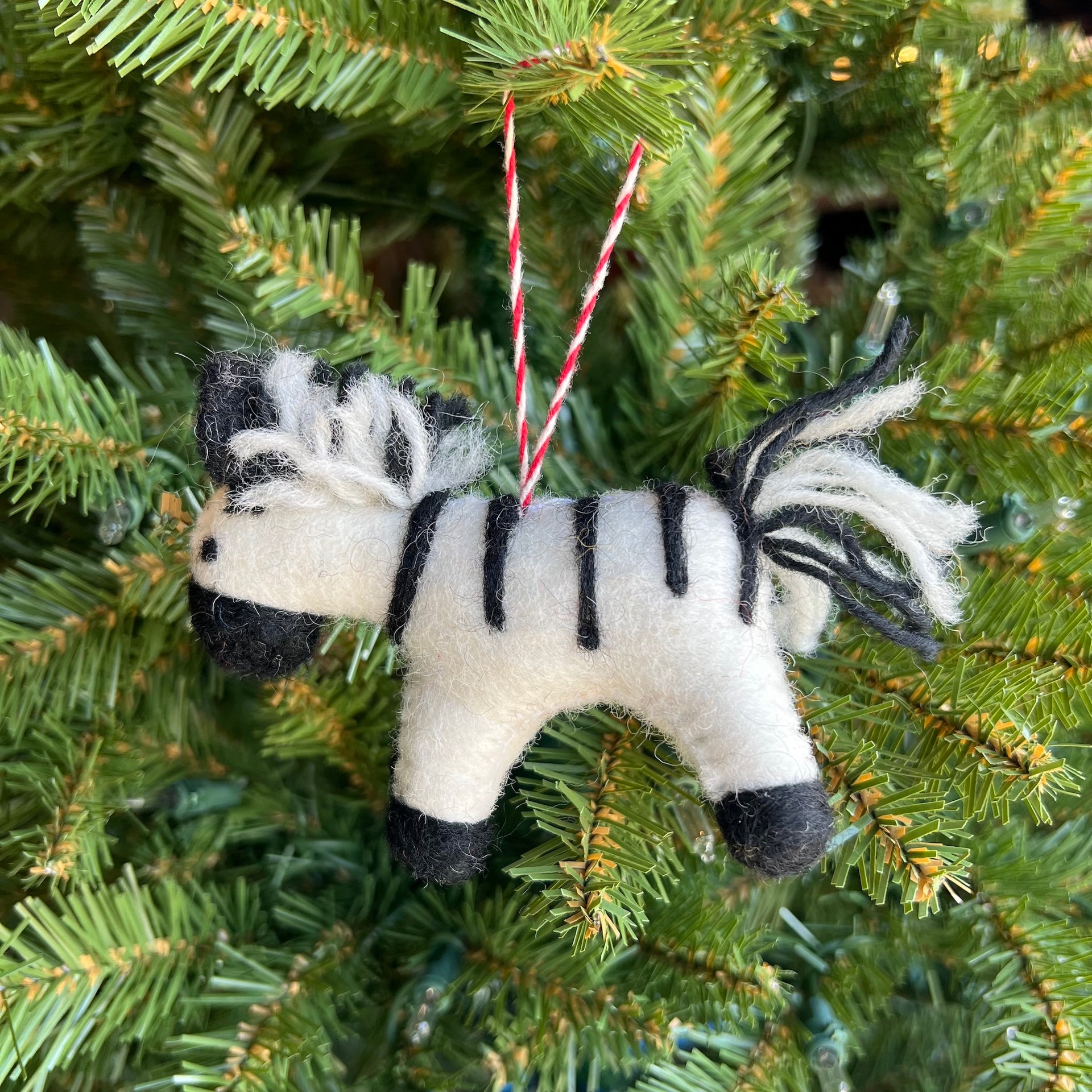 Felt Zebra Ornament hanging on a Christmas Tree