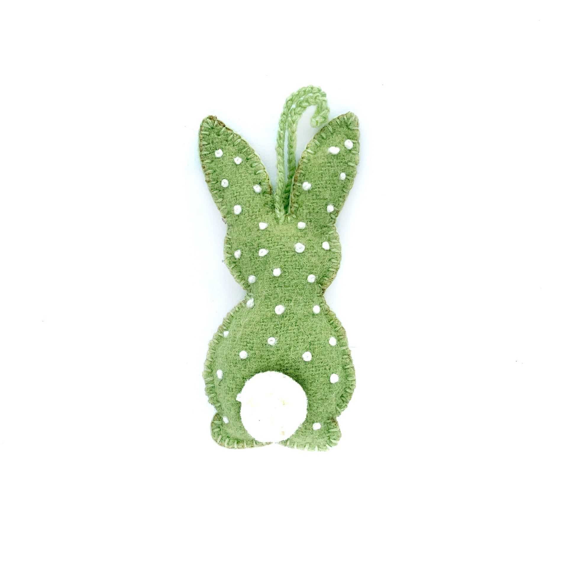 Pastel green handmade Easter bunny ornament with embroidered white dots and pom pom tail.