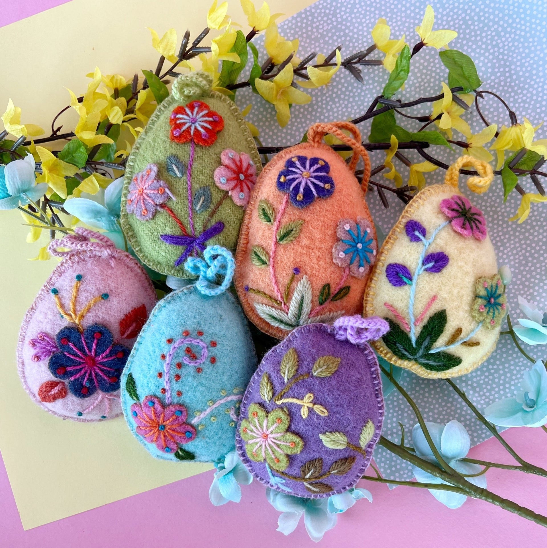 Six embroidered wool Easter Egg Ornaments in pastel colors styled for spring