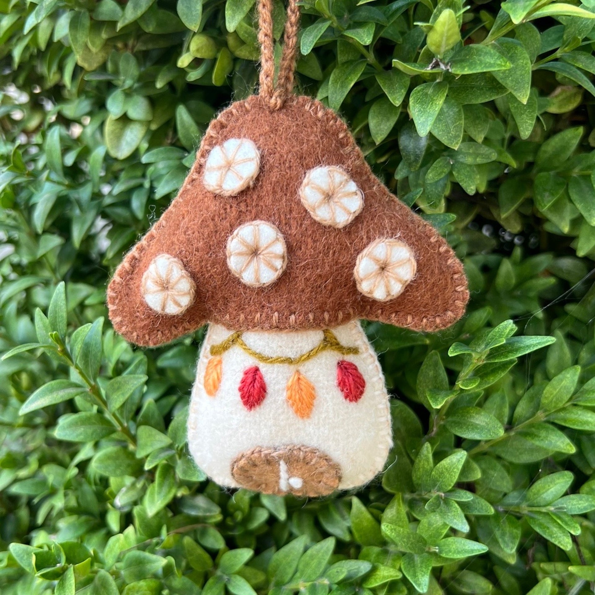 Fair trade Mushroom Ornament outside for fall