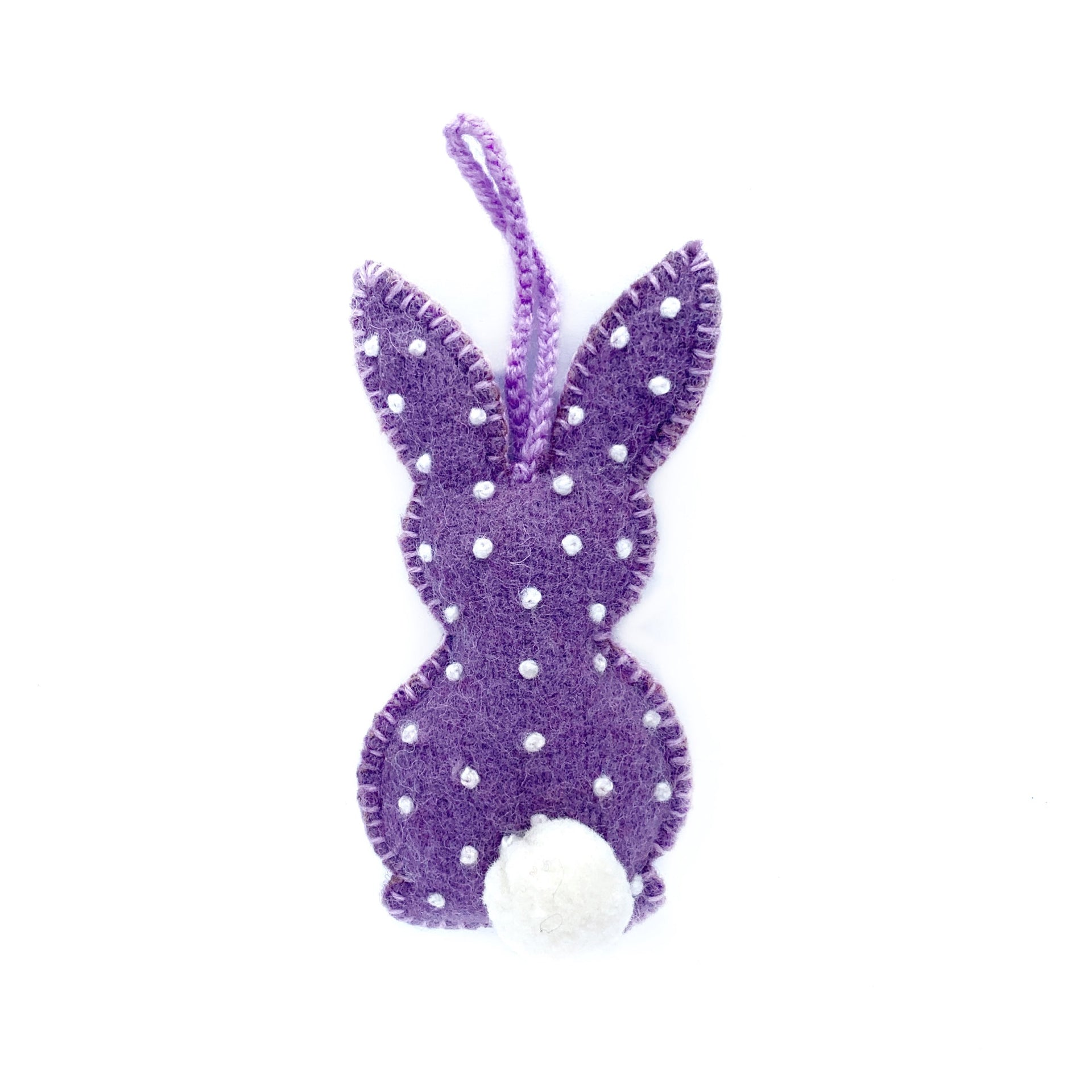 Pastel purple handmade Easter bunny ornament with embroidered white dots and pom pom tail.