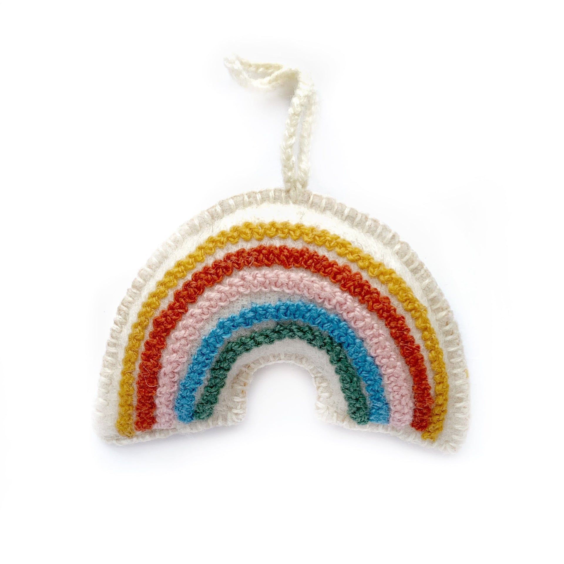 Hand embroidered wool rainbow ornament in pastel muted colors.