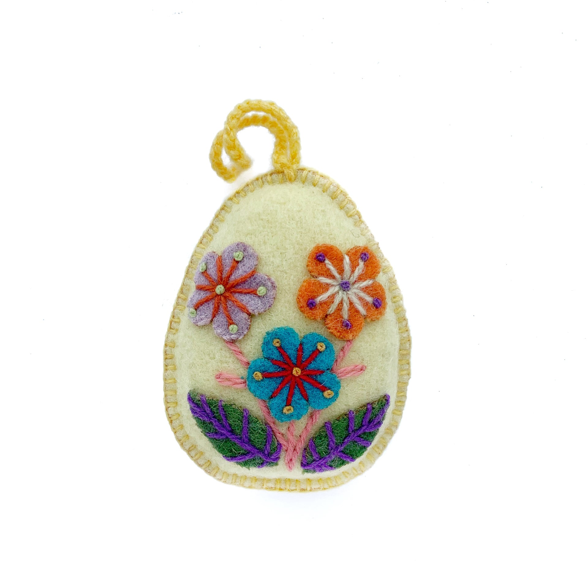 Soft yellow pastel Easter egg ornament with hand embroidered flowers and designs.